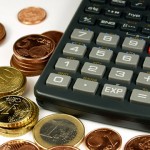 euros coin and a calculator
