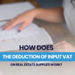 How does the input VAT deduction for real estate supplies work?