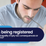 Does being registered in a municipality imply tax consequences or obligations?